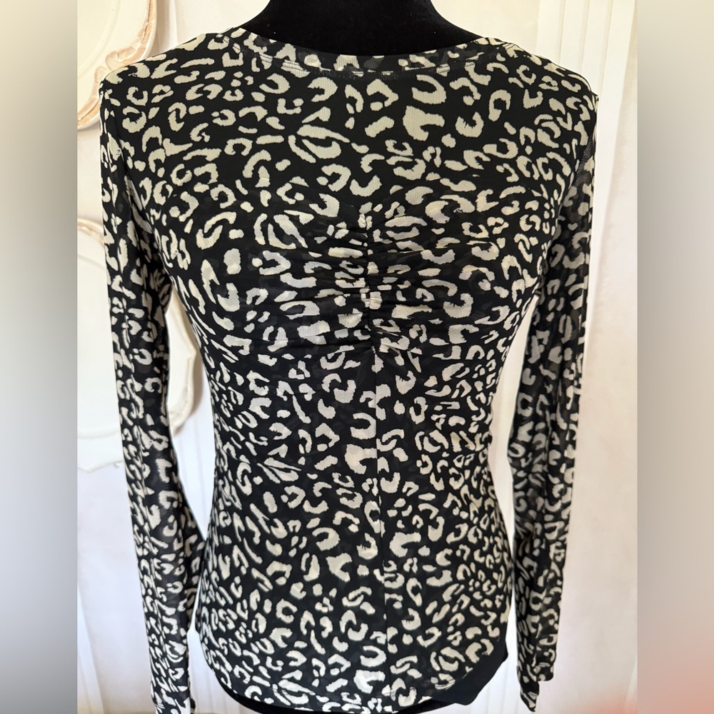 New without tags CAbi Black and cream Leopard Long Sleeve top